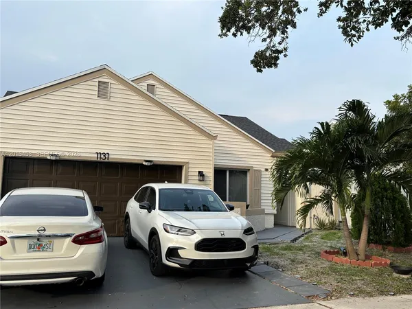 a car parked in front of a house