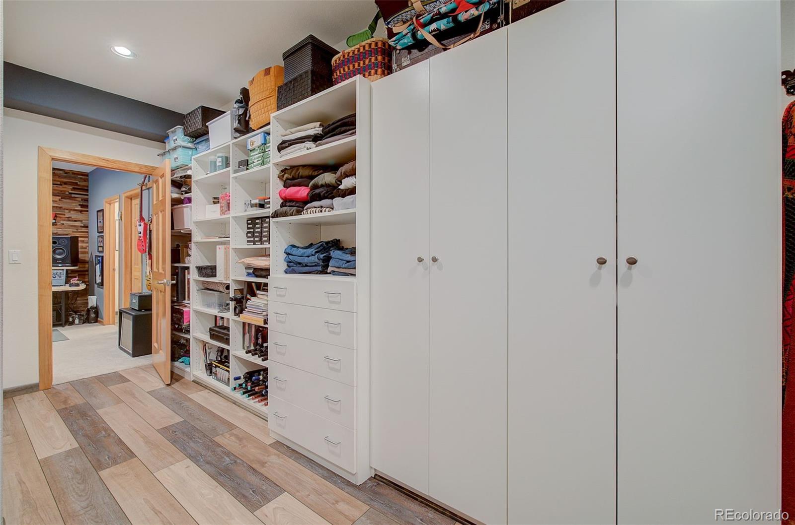 665 Trailside Drive Golden, CO 80401 - Photo 15 of 40 a view of walk in closet with clothes and shoes