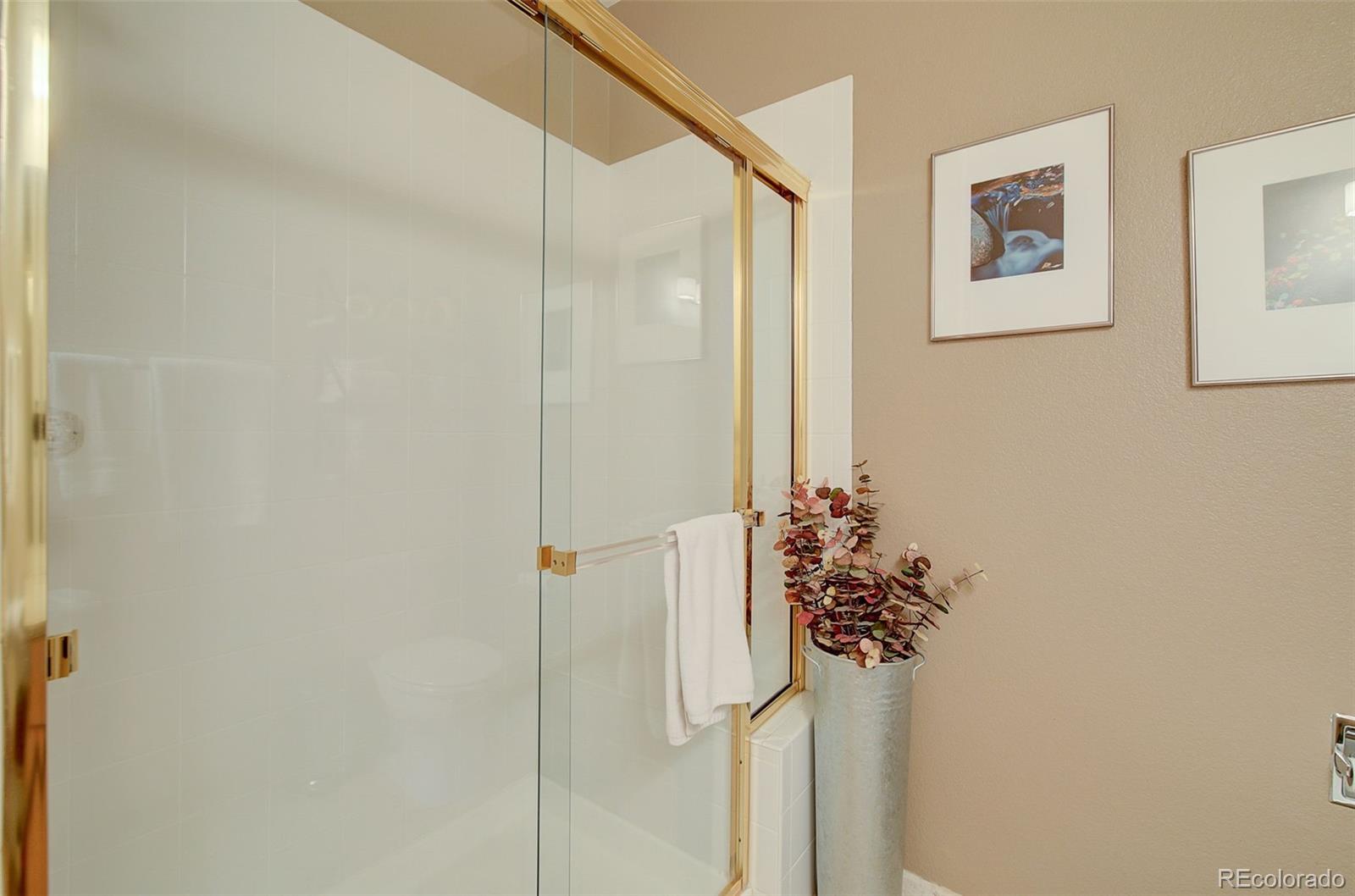 665 Trailside Drive Golden, CO 80401 - Photo 19 of 40 a bathroom with a shower and a sink
