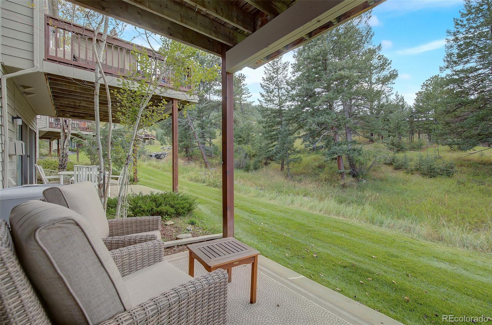 665 Trailside Drive Golden, CO 80401 - Photo 27 of 40 a view of a chair and tables in the balcony