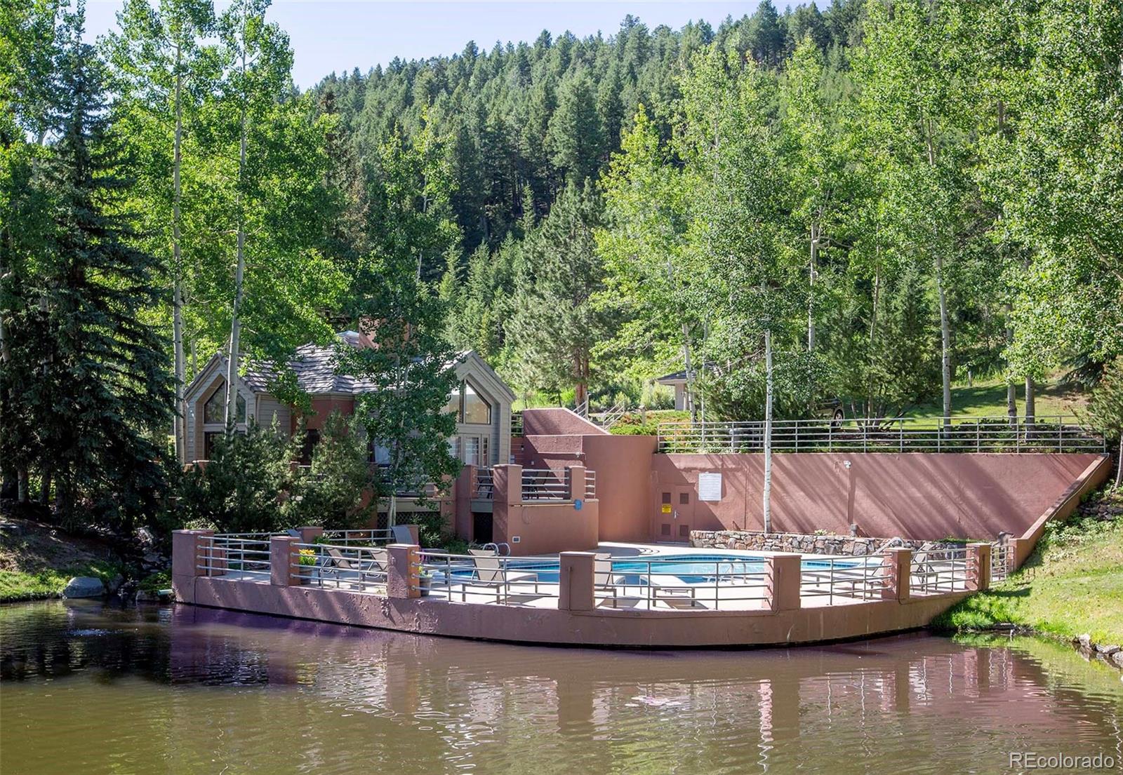 665 Trailside Drive Golden, CO 80401 - Photo 38 of 40 a view of a lake with house