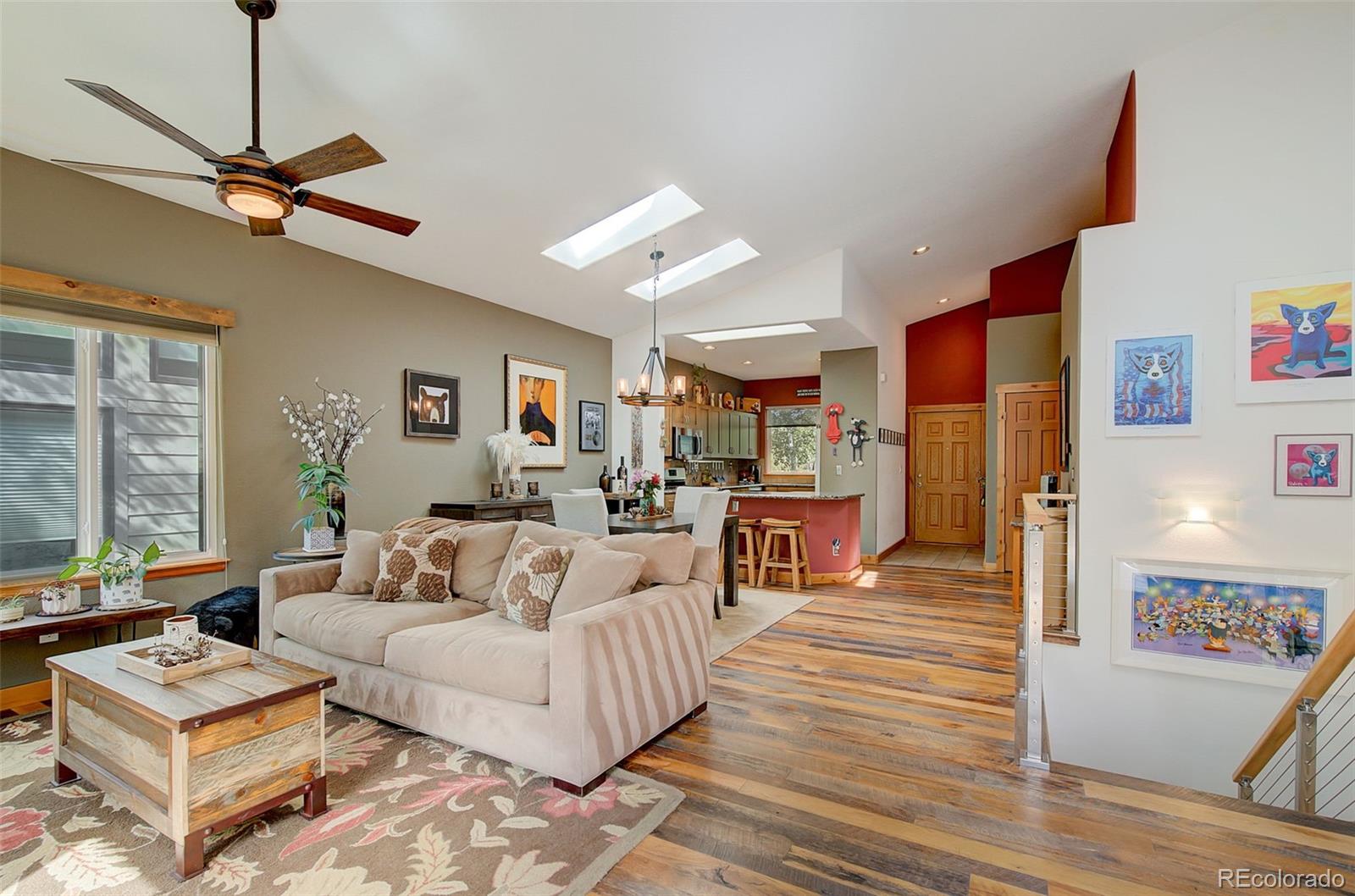 665 Trailside Drive Golden, CO 80401 - Photo 4 of 40 a living room with furniture and a wooden floor
