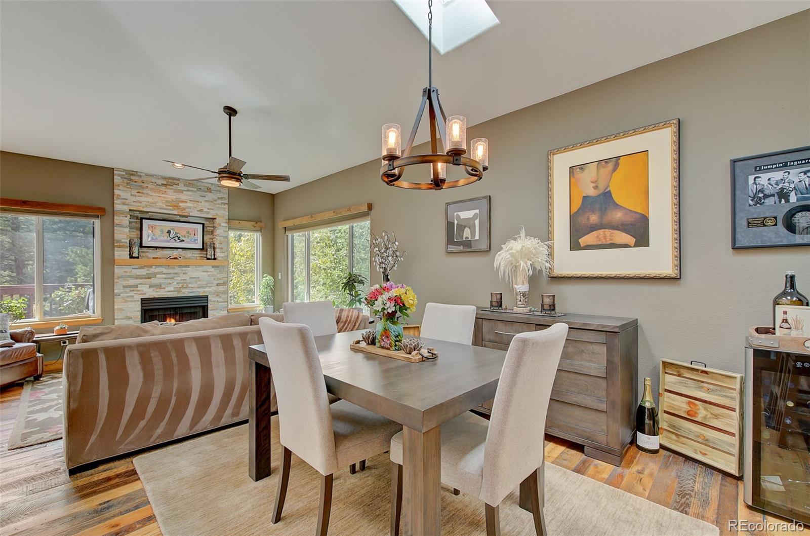 665 Trailside Drive Golden, CO 80401 - Photo 5 of 40 a view of a dining room with furniture window and wooden floor