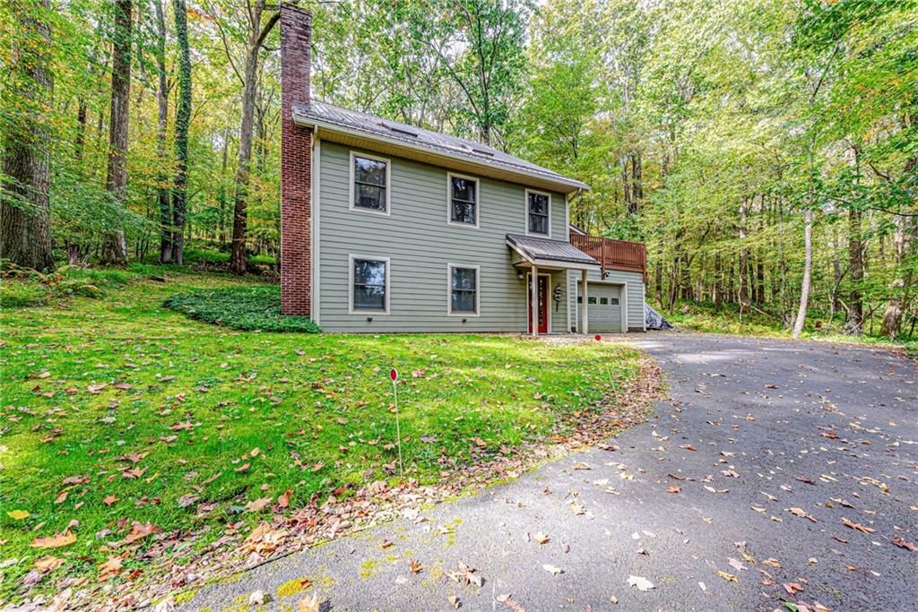 508 Forest Road Acme, PA 15610 - Photo 1 of 29 a front view of house with yard and green space