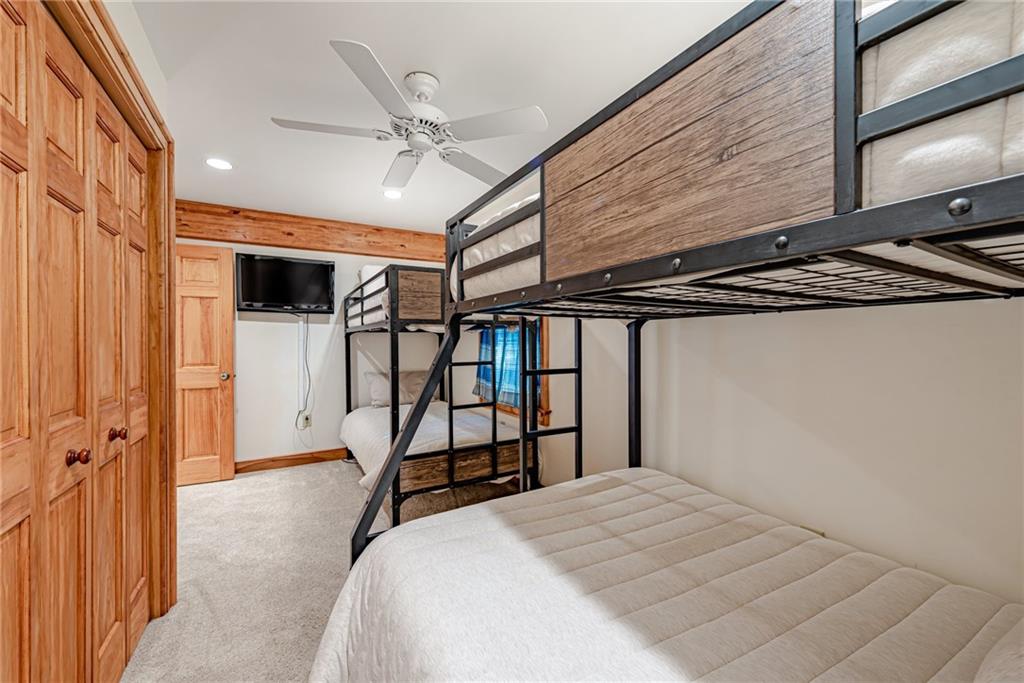 508 Forest Road Acme, PA 15610 - Photo 19 of 29 a bedroom with a bed and a chandelier