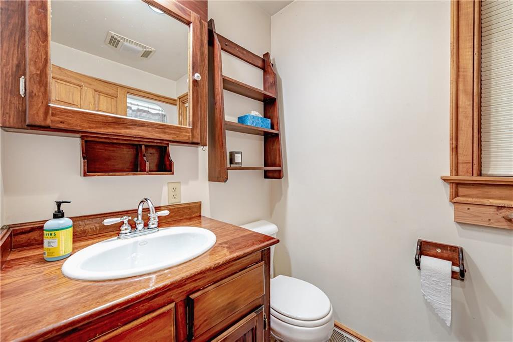 508 Forest Road Acme, PA 15610 - Photo 20 of 29 a bathroom with a sink a toilet and a mirror