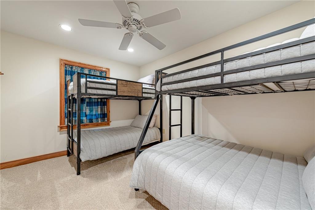 508 Forest Road Acme, PA 15610 - Photo 21 of 29 a bedroom with two beds and a chandelier