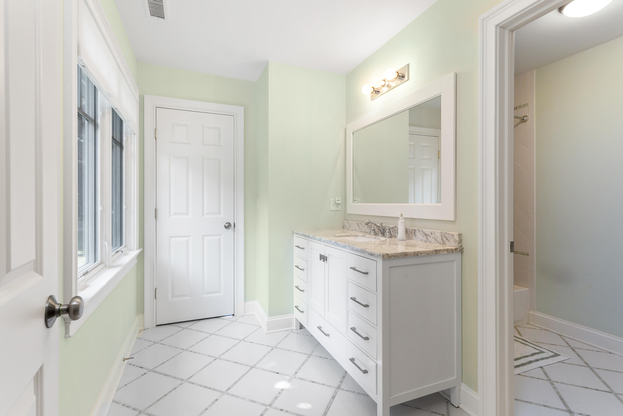 21 Ledge Road Norwalk, CT 06853 - Photo 20 of 32 a bathroom with a sink a mirror and a vanity