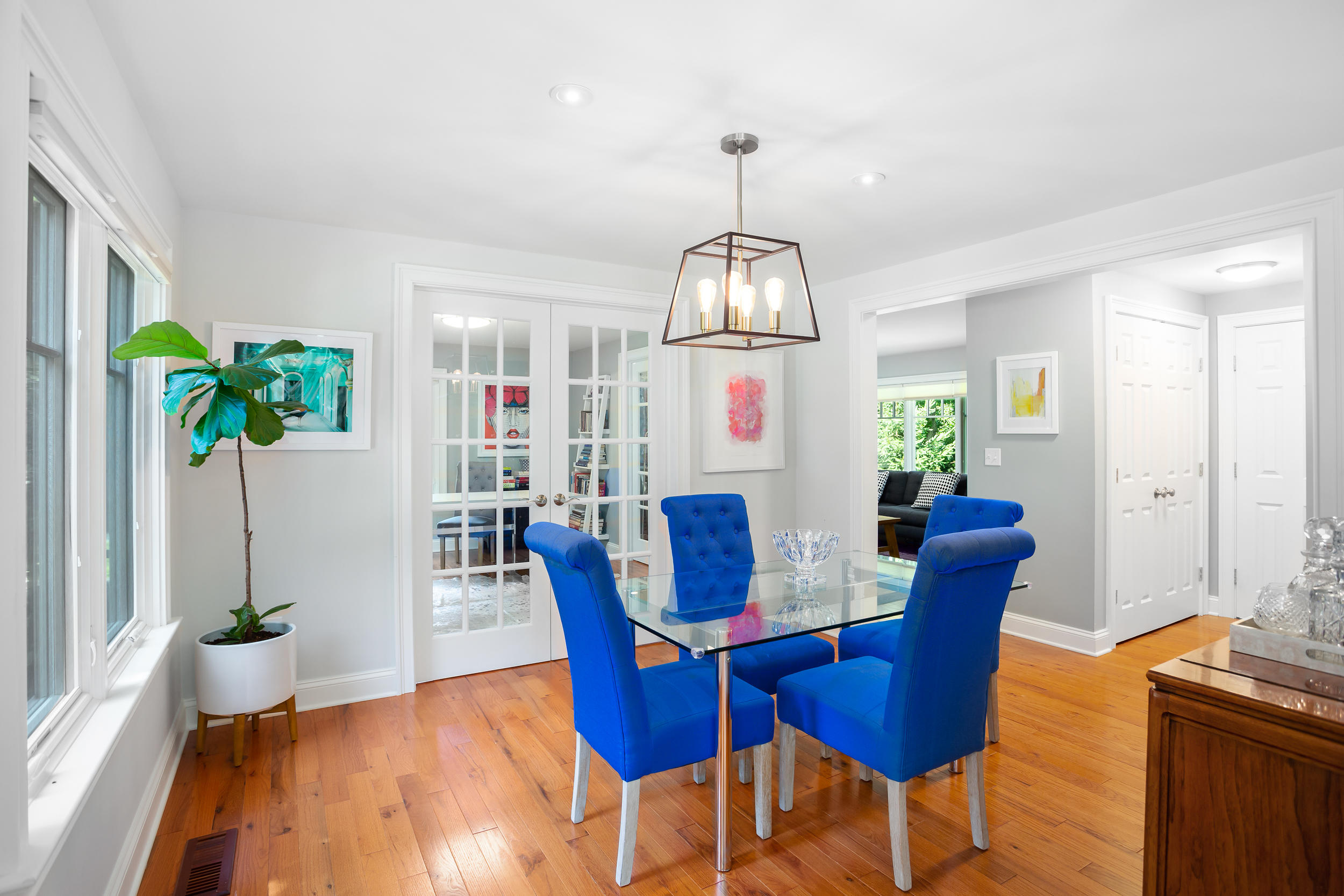 21 Ledge Road Norwalk, CT 06853 - Photo 7 of 32 a view of a dining room with furniture a chandelier and wooden floor
