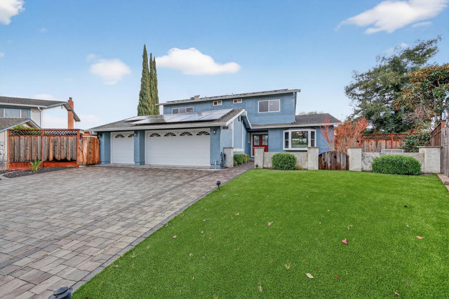 7100 Potomac Place Gilroy, CA 95020 - Photo 1 of 37 a front view of a house with garden