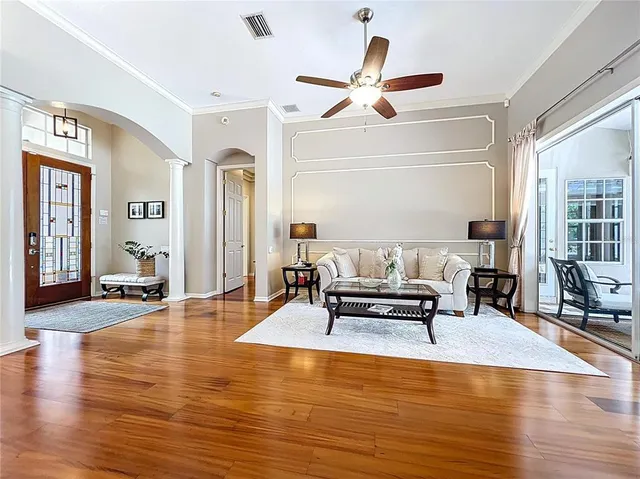 a kitchen with stainless steel appliances kitchen island granite countertop a refrigerator and microwave