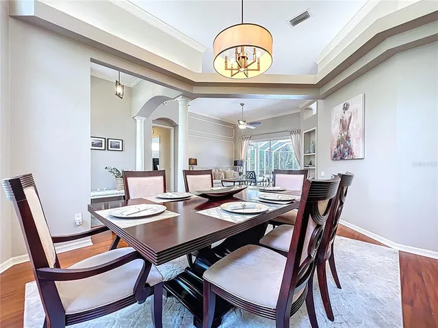 a kitchen with granite countertop stainless steel appliances a sink counter space and a refrigerator