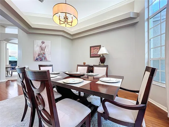 a living room with furniture fireplace and a large window