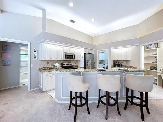 a bedroom with a large bed and a flat screen tv