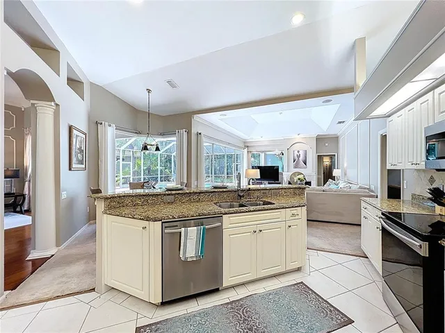 a bedroom with a bed and a large mirror