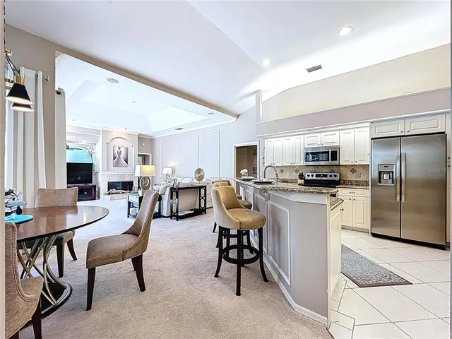 a spacious bedroom with a bed and a flat screen tv