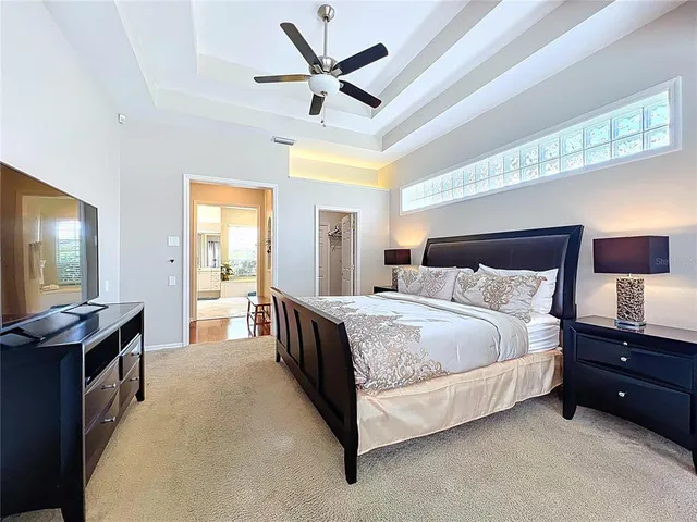 a bathroom with a toilet a sink a mirror a shower and vanity