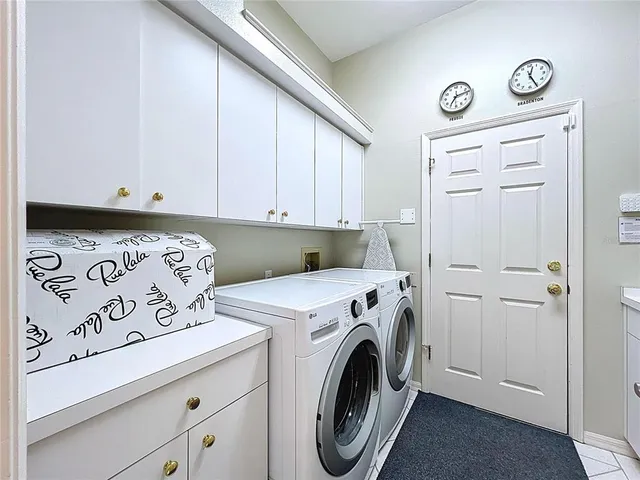an aerial view of house with yard swimming pool and outdoor seating