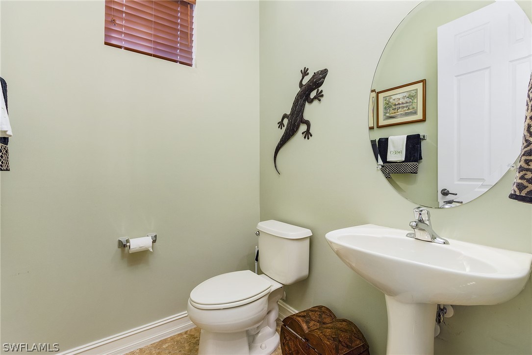 11947 Tulio Way, Unit 4002 Fort Myers, FL 33912 - Photo 16 of 26 a bathroom with a toilet and a sink