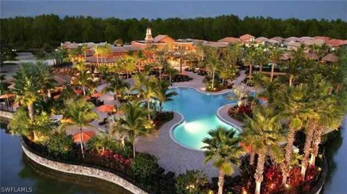 11947 Tulio Way, Unit 4002 Fort Myers, FL 33912 - Photo 20 of 26 a view of a houses with a yard