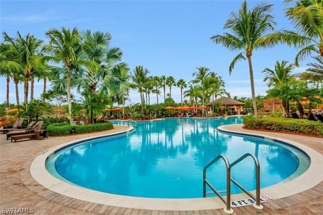 11947 Tulio Way, Unit 4002 Fort Myers, FL 33912 - Photo 22 of 26 a view of swimming pool having outdoor seating