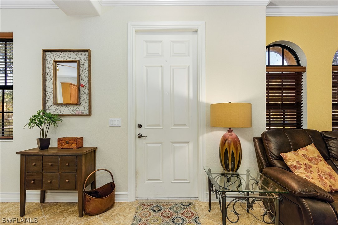 11947 Tulio Way, Unit 4002 Fort Myers, FL 33912 - Photo 4 of 26 a bedroom with bed and a potted plant