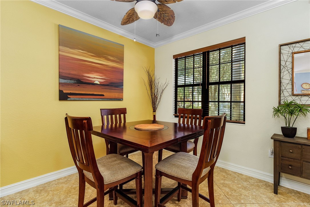 11947 Tulio Way, Unit 4002 Fort Myers, FL 33912 - Photo 7 of 26 a view of a dining room with furniture window and outside view