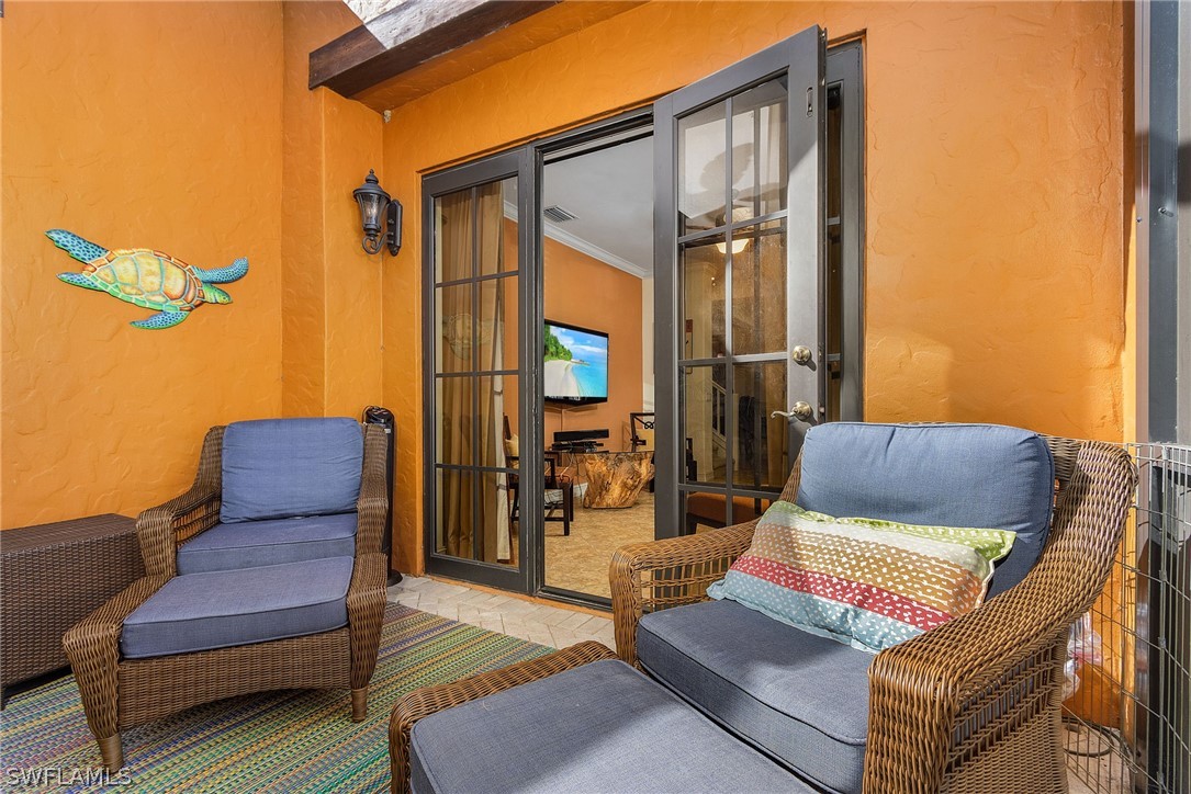 11947 Tulio Way, Unit 4002 Fort Myers, FL 33912 - Photo 10 of 26 a view of sitting area with furniture and a couch