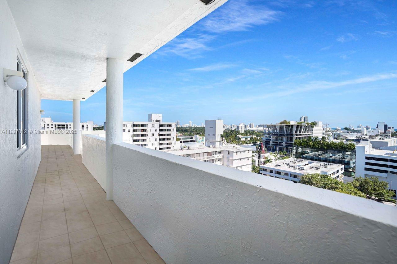 1621 Bay Road, Unit PH1 Miami Beach, FL 33139 - Photo 8 of 32 a view of a balcony with city view