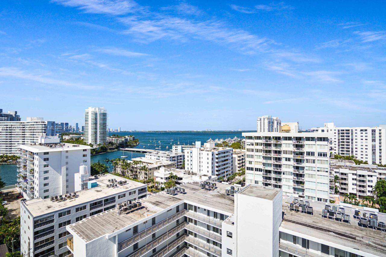 1621 Bay Road, Unit PH1 Miami Beach, FL 33139 - Photo 10 of 32 a view of a city with tall buildings
