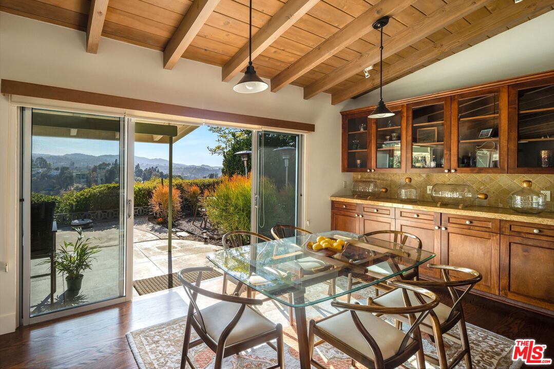 3823 Cody Road Sherman Oaks, CA 91403 - Photo 13 of 38 a view of a patio with table and chairs