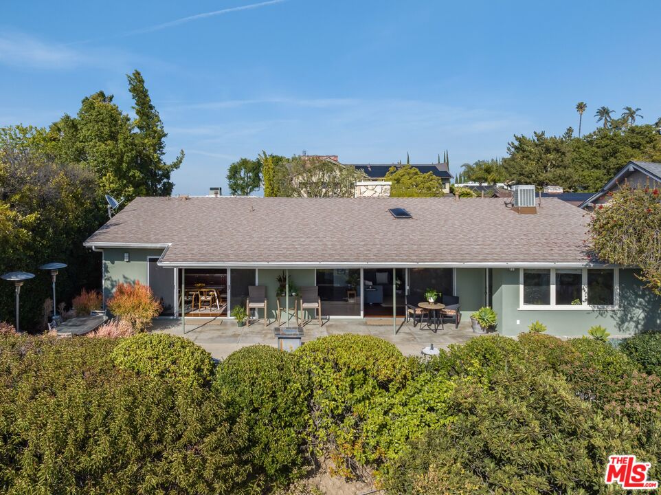 3823 Cody Road Sherman Oaks, CA 91403 - Photo 28 of 38 a view of a house with patio and a garden