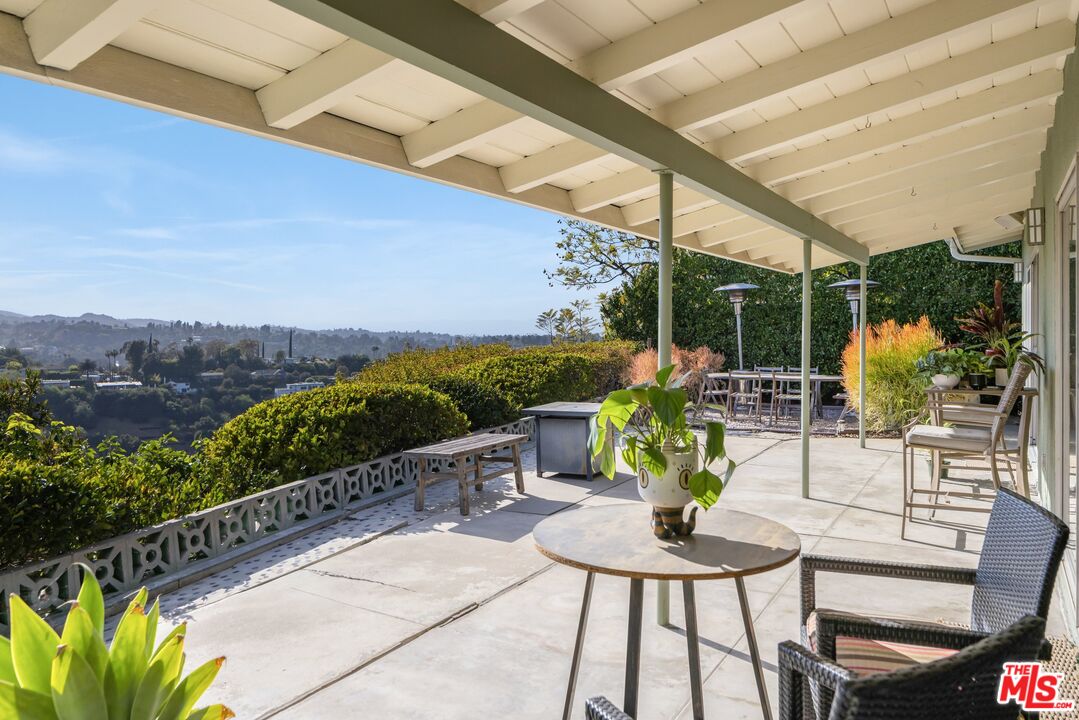 3823 Cody Road Sherman Oaks, CA 91403 - Photo 30 of 38 a view of a chairs and table in patio