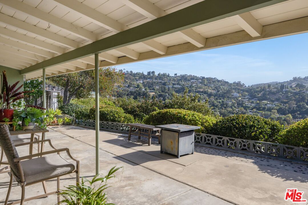 3823 Cody Road Sherman Oaks, CA 91403 - Photo 31 of 38 a view of a patio with a table and chairs