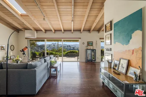 a living room with fireplace furniture and a flat screen tv