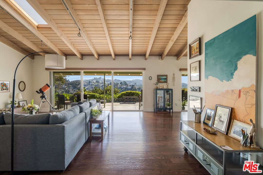3823 Cody Road Sherman Oaks, CA 91403 - Photo 4 of 38 a living room with furniture and a floor to ceiling window