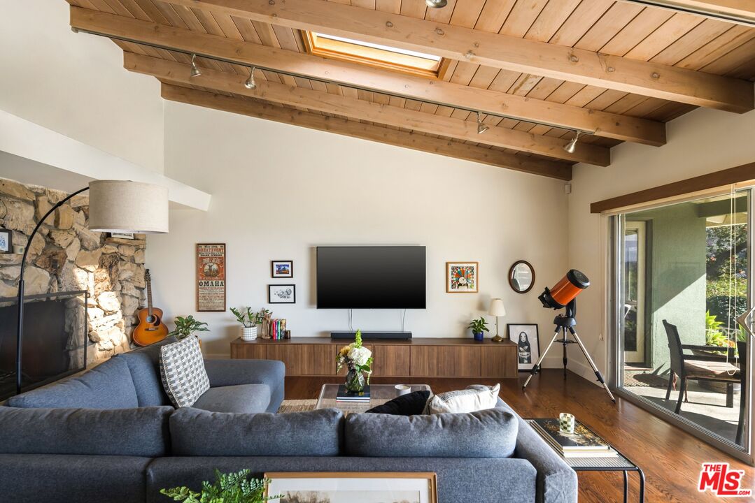 3823 Cody Road Sherman Oaks, CA 91403 - Photo 5 of 38 a living room with furniture and a flat screen tv