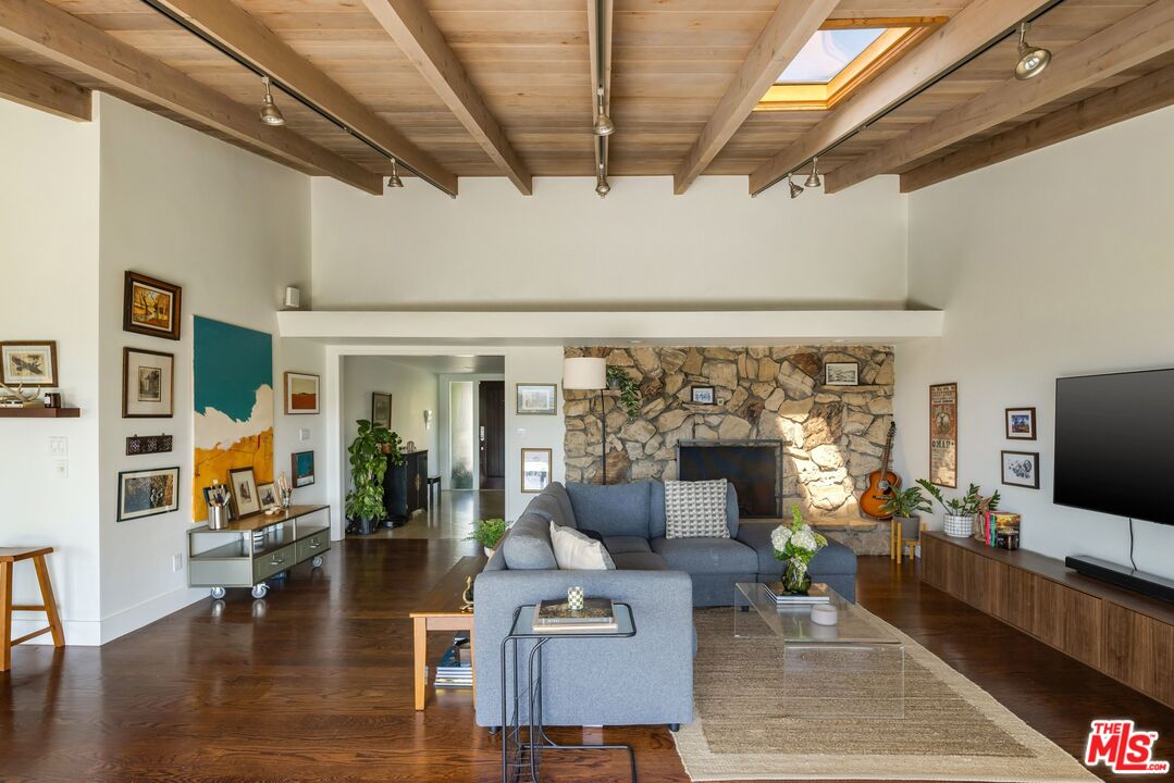 3823 Cody Road Sherman Oaks, CA 91403 - Photo 7 of 38 a living room with fireplace furniture and a flat screen tv