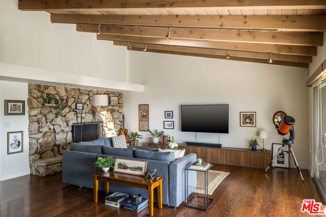 3823 Cody Road Sherman Oaks, CA 91403 - Photo 8 of 38 a living room with furniture and a flat screen tv