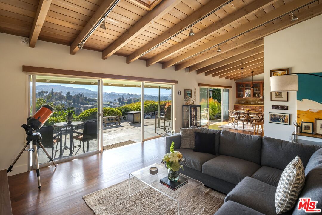 3823 Cody Road Sherman Oaks, CA 91403 - Photo 9 of 38 a living room with furniture and a large window