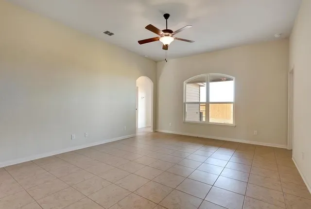 a view of an empty room with a window