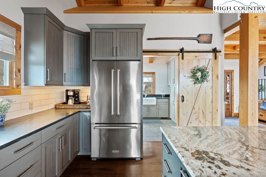 331 May Apple Trail Newland, NC 28657 - Photo 11 of 48 a kitchen with a refrigerator a sink and cabinets