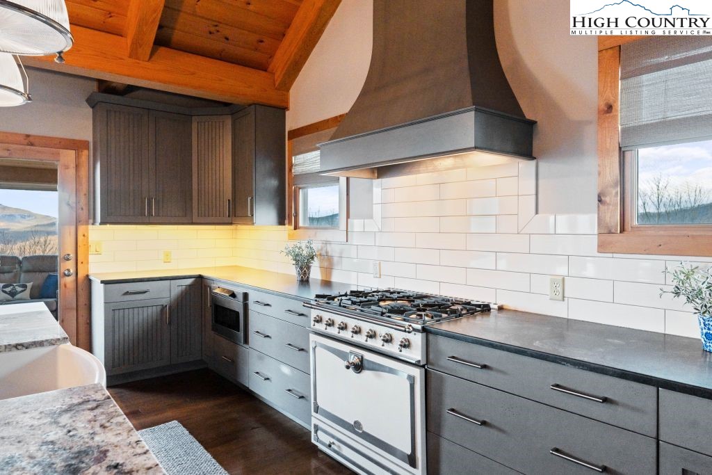 331 May Apple Trail Newland, NC 28657 - Photo 12 of 48 a kitchen with stainless steel appliances granite countertop a stove and a sink