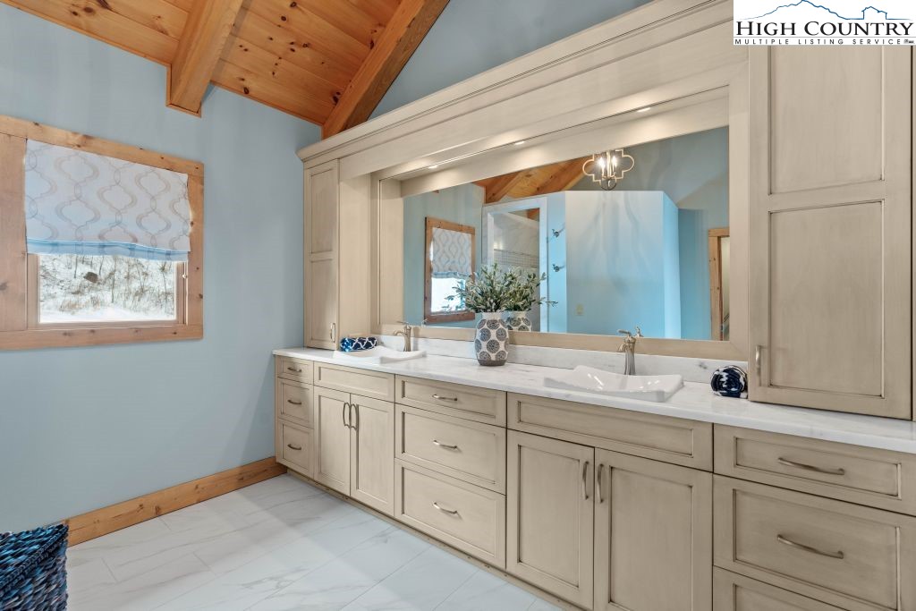 331 May Apple Trail Newland, NC 28657 - Photo 15 of 48 a en suite bathroom with double sink and a mirror