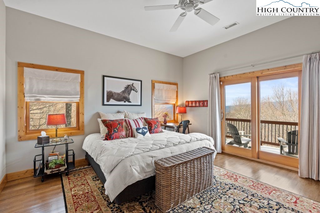 331 May Apple Trail Newland, NC 28657 - Photo 18 of 48 a bedroom with a bed and a table in it