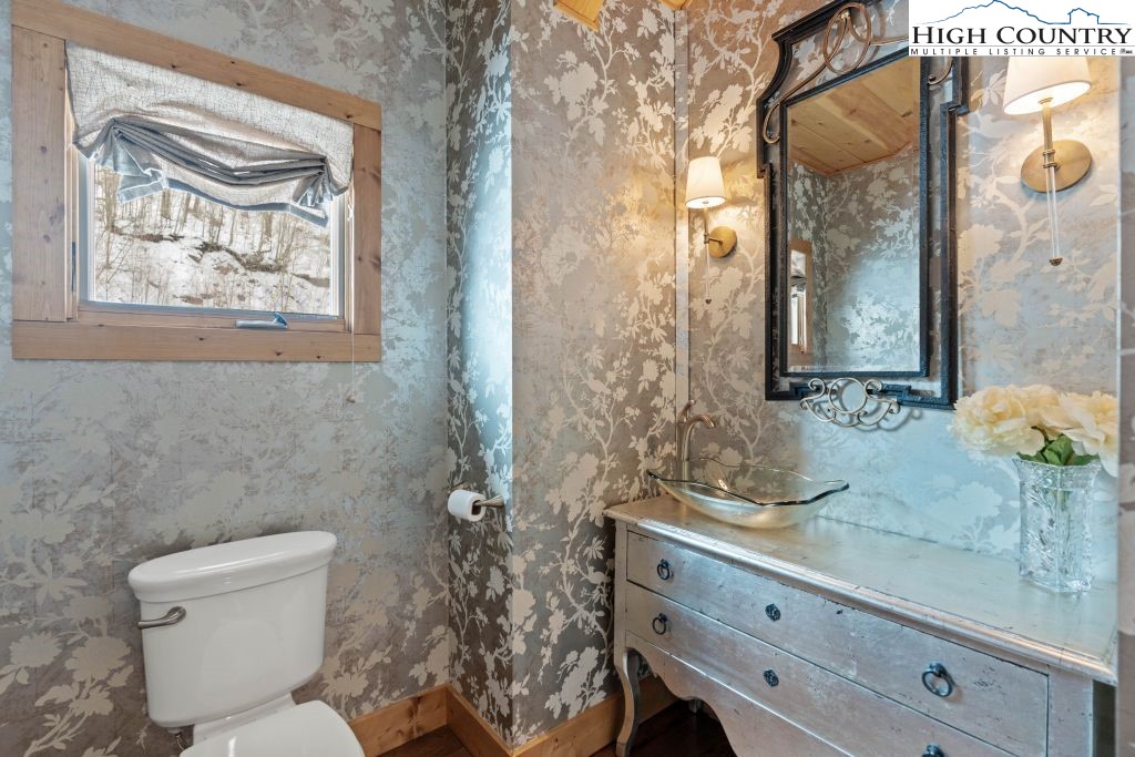 331 May Apple Trail Newland, NC 28657 - Photo 29 of 48 a bathroom with a toilet a sink and glass door