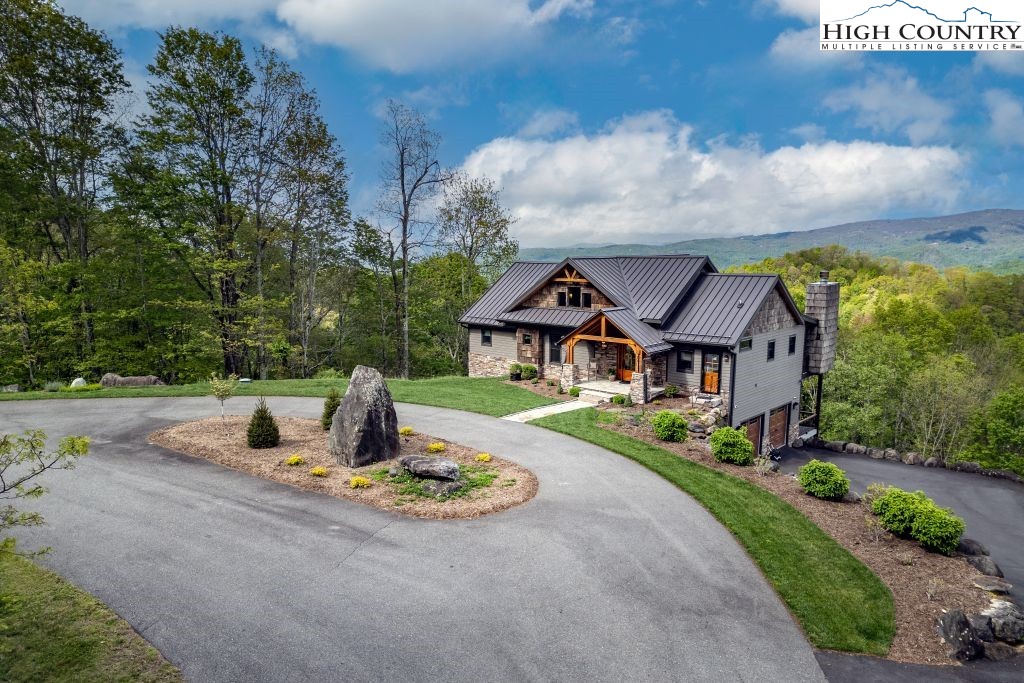 331 May Apple Trail Newland, NC 28657 - Photo 38 of 48 a front view of a house with a garden