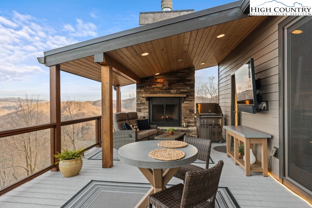 331 May Apple Trail Newland, NC 28657 - Photo 4 of 48 a outdoor dining space with furniture and wooden floor