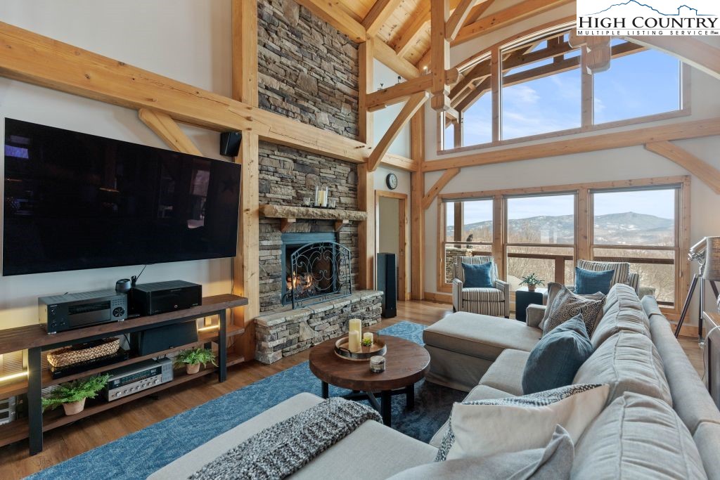 331 May Apple Trail Newland, NC 28657 - Photo 9 of 48 a living room with furniture a flat screen tv and a fireplace