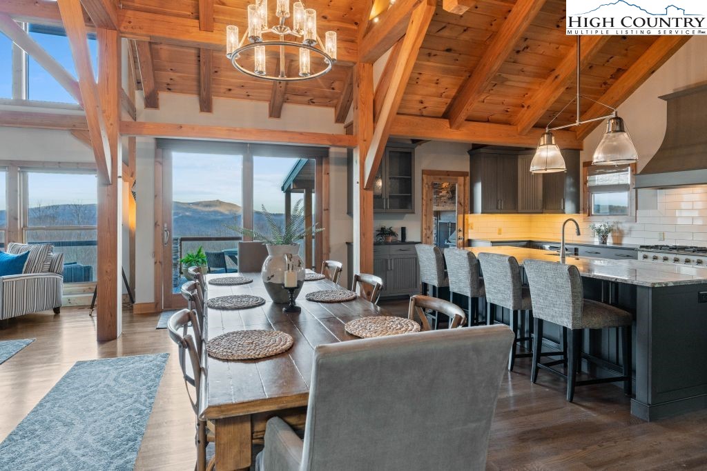 331 May Apple Trail Newland, NC 28657 - Photo 10 of 48 a view of a patio with dining table and chairs
